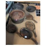 Collection of cast iron pans, pot and more,