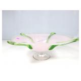 A large frosted glass bowl with green trim with a