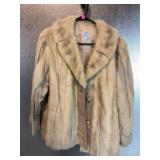 This is a vintage cream, colored genuine, fur and
