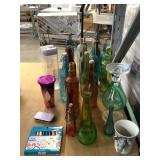 Collection of multi colored bottles and more