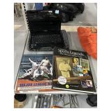 Toshiba Laptop and Vintage Baseball Books.