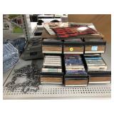 Collection of Cassettes, VHS Tape Rewinder, and