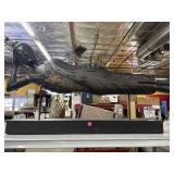 Large reclining Buddha sculpture with a dark