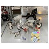Collection of Ceramic Zebra Figurines and More.