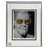 A framed portrait, print or drawing of comic book