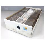 A box of hundreds of empty snap tight sports card
