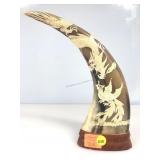 A vintage hand carved waterbuffalo horn featuring
