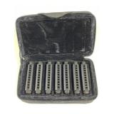 A set of seven Hohner Piedmont blues harmonicas