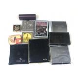 A collection of pocket size, cigarette cases,