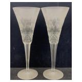 A pair of engraved champagne, flutes with a