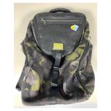 A Tumi brand zippered backpack in the JG series