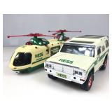 Two HESS toy vehicles one is a hummer that holds