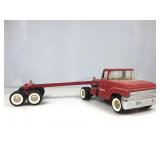 Structo,cab and log hauler transport.  Four axle