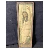 A vintage framed advertising print featuring