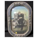An antique oval portrait housed in an ornate