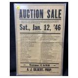 Framed under acrylic is a vintage auction sale