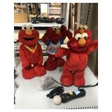 Vintage Animated Elmo Dolls and SONY Controller.