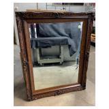 Large framed beveled mirror in a beautiful fancy