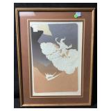 A vintage framed landscape art print featuring a