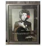 A framed black-and-white portrait of legendary