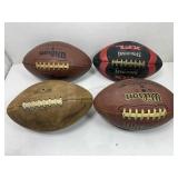 Lot of four footballs