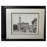 A framed black and white photograph appears to