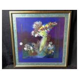 A framed artwork appears to be a signed mixed