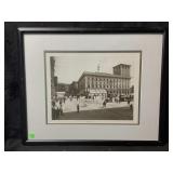 A framed black and white photograph shows a