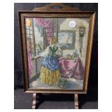 A vintage framed needlepoint tapestry depicting a