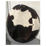 Cow hide ottoman, approx 42x13in