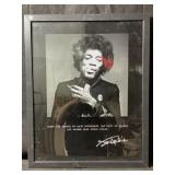 A framed black-and-white portrait of legendary