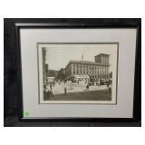 A framed black and white photograph shows a