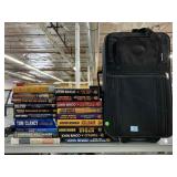 Variety of Hard Back Books and Carry On Luggage.