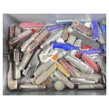 Collection of assorted used pocket knives, some