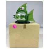 A handmade glass fish with a clear, crackle body