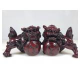 A pair of vintage Chinese red, resin Foo dog