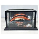 Dick Butkus autographed football in case