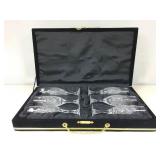 A set of six matching engraved champagne, flutes