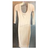 A white long sleeve body con midi dress featuring