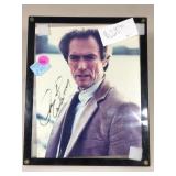 An autographed picture of Clint Eastwood in a