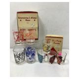 Two sets of shot glasses novelty type still in