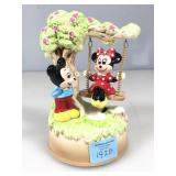 Ceramic music box with Mickey and Minnie.    Many