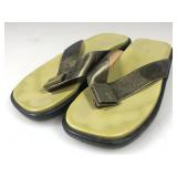 A pair of used Louis Vuitton slip on style