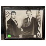 Black and white photo of a man shaking hands with