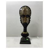 A hand carved wooden African tribal mask,