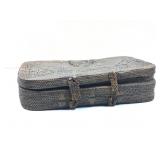 A vintage tightly woven rattan storage box
