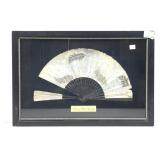 An antique folding hand fan likely from the late