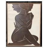 A minimalist framed painting of a seated woman in