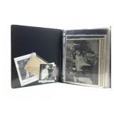 Three ring binder with postcards, stories, photos