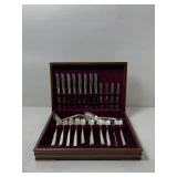 Fancy silverware set in wooden box with dark